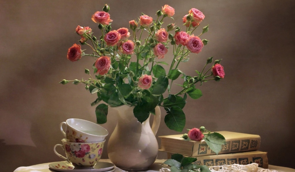 Still life of vintage books and roses wallpaper 1024x600