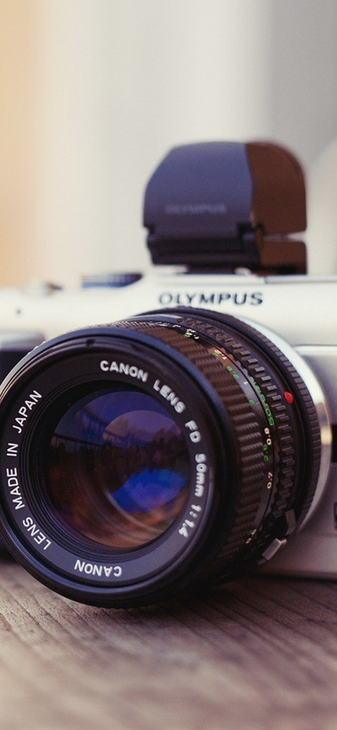 Обои Olympus DSLR Camera 1170x2532