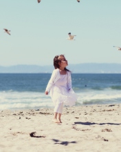 Little Girl At Beach And Seagulls wallpaper 176x220