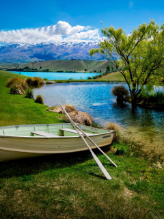 Fondo de pantalla Boat on Mountain River 240x320