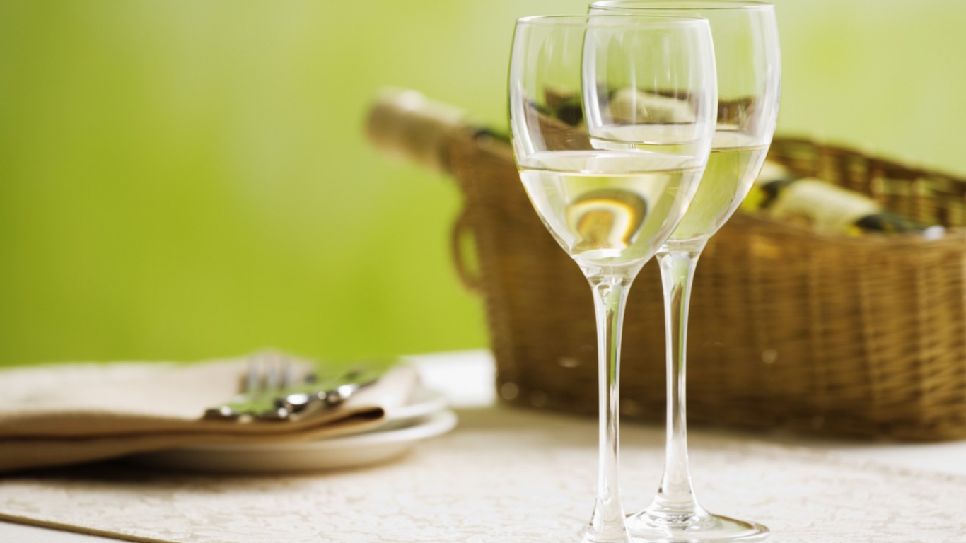Sfondi Two Glaeese Of White Wine On Table 1366x768
