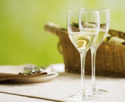 Two Glaeese Of White Wine On Table wallpaper 176x144