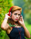 Sweet girl in headphones wallpaper 128x160