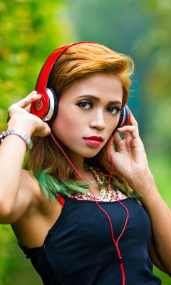 Sweet girl in headphones wallpaper 240x400