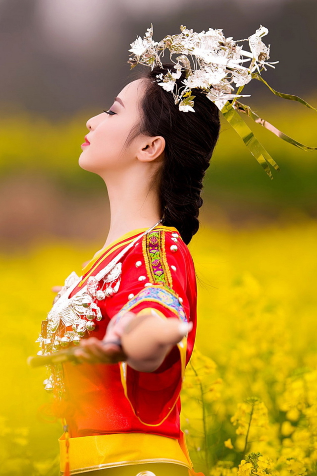 Asian Girl In Yellow Flower Field wallpaper 640x960