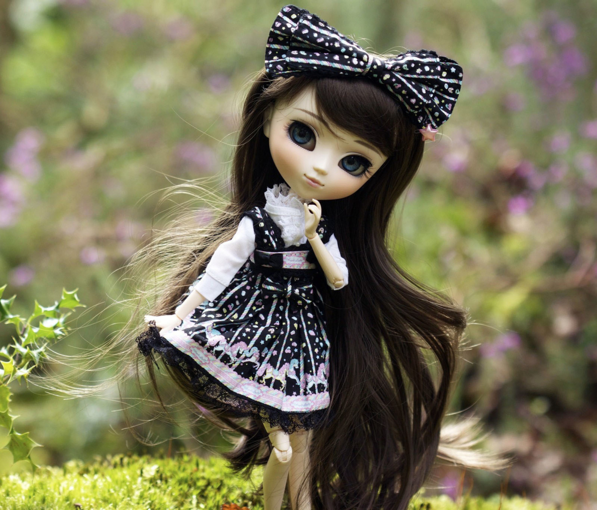 Cute Doll With Dark Hair And Black Bow wallpaper 1200x1024