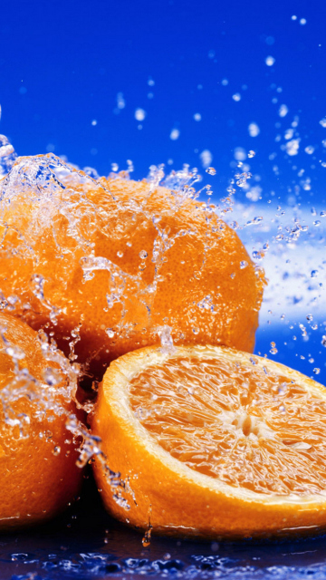 Das Juicy Oranges In Water Drops Wallpaper 360x640