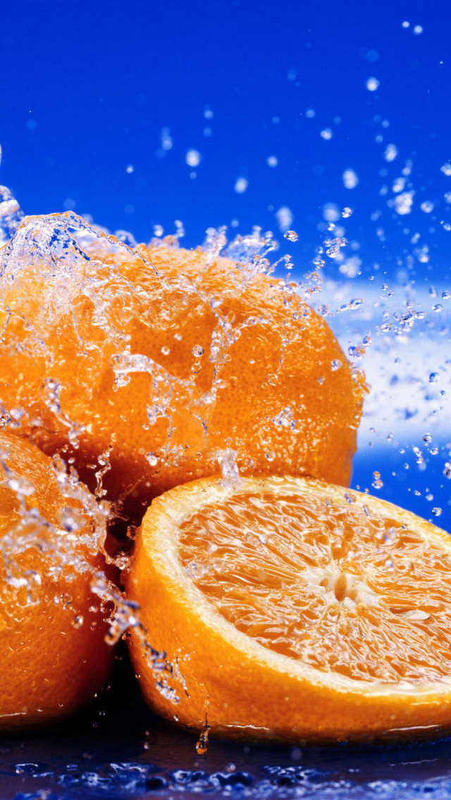 Juicy Oranges In Water Drops wallpaper 640x1136