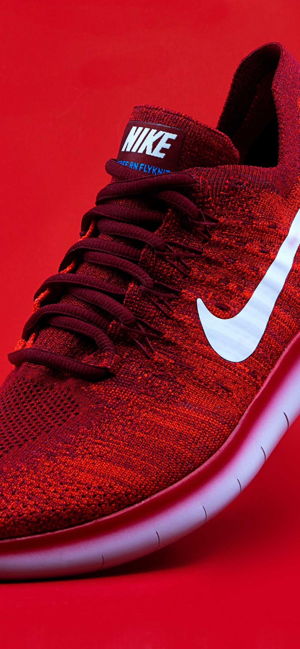 Red Nike Shoes wallpaper 1170x2532