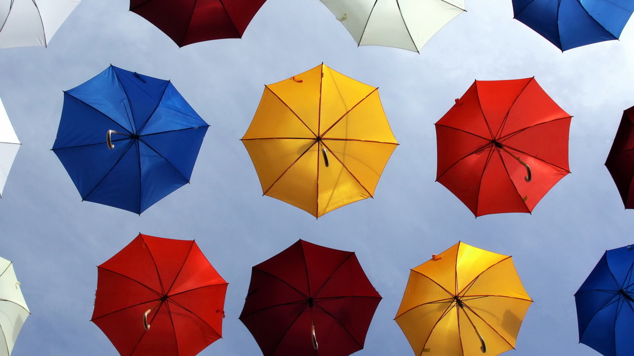 Colorful Umbrellas In Blue Sky wallpaper 1280x720