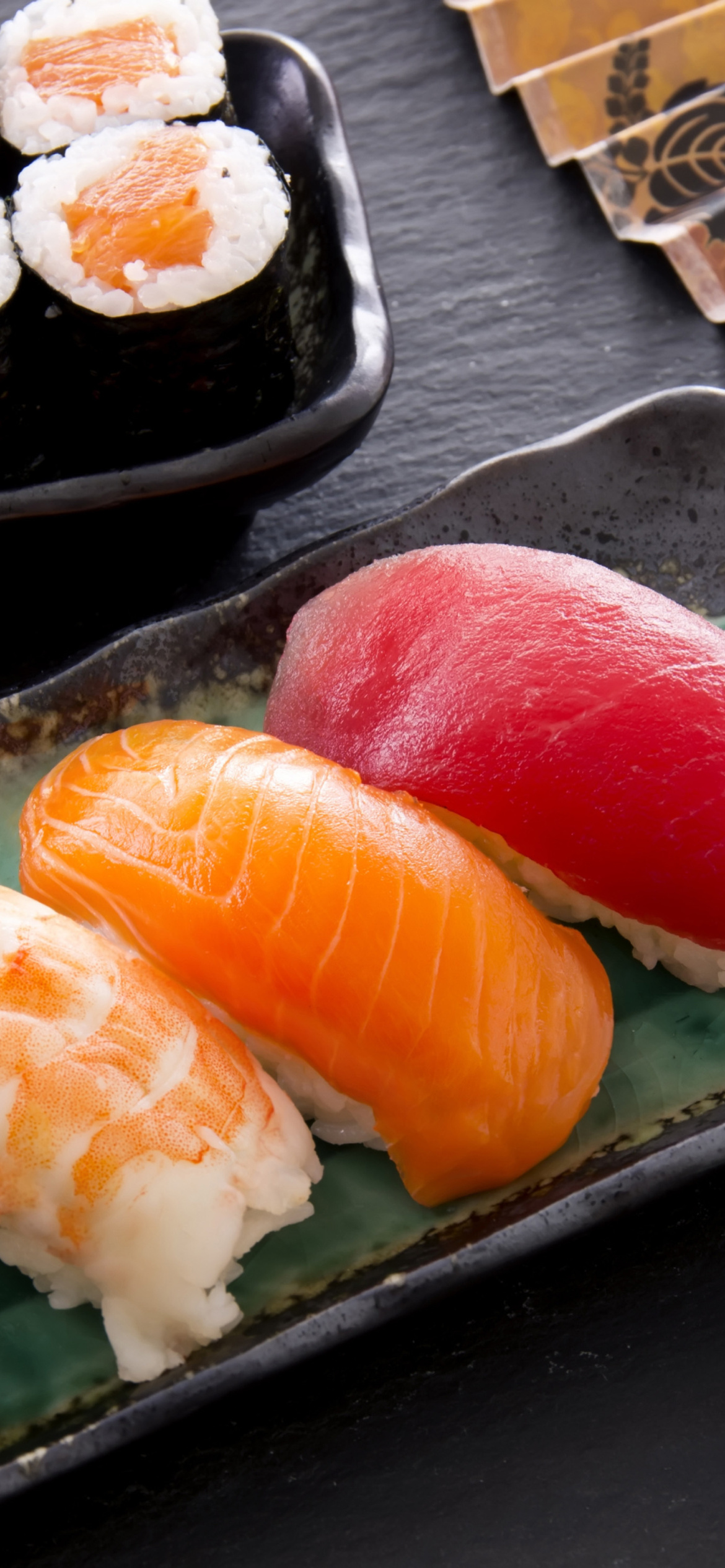 Sushi with salmon, tuna and shrimp wallpaper 1170x2532