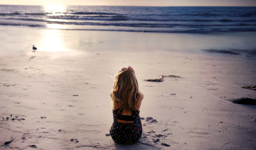 Lonely Girl On Beautiful Beach wallpaper 1024x600