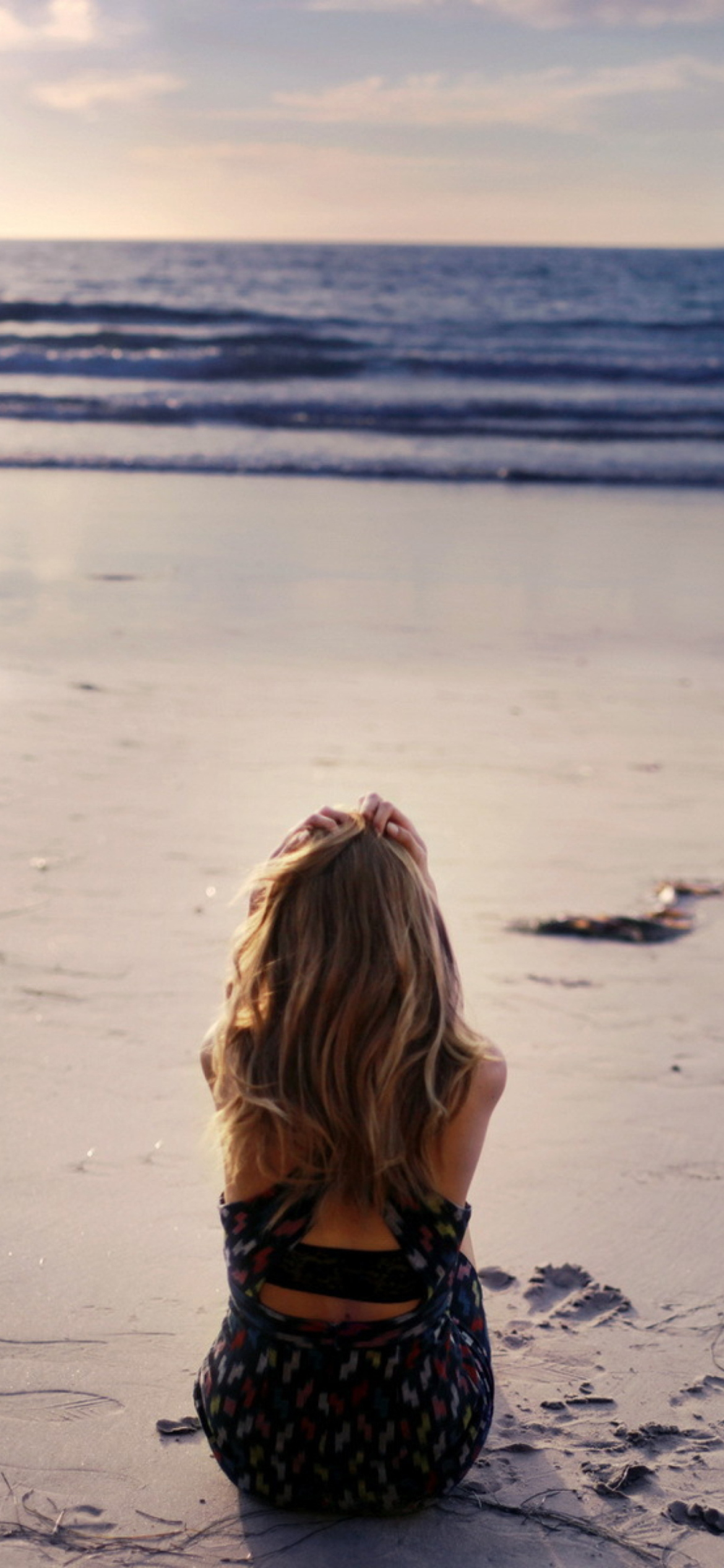 Lonely Girl On Beautiful Beach wallpaper 1170x2532