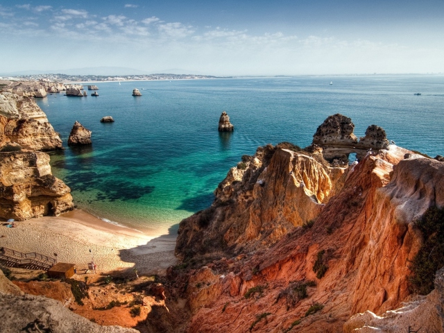 Обои Beautiful Bay Behind Ocean Rocks 640x480