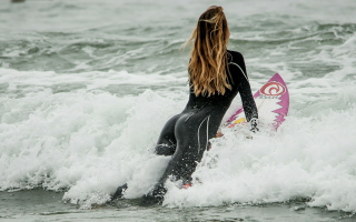 Girl Catching Wave Wallpaper for Android, iPhone and iPad