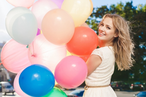 Smiling Girl With Balloons wallpaper 480x320