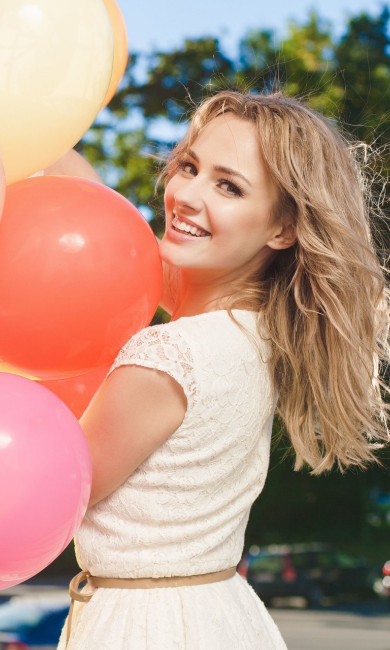 Smiling Girl With Balloons wallpaper 768x1280